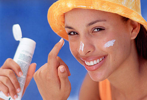 Woman Applying Sunscreen